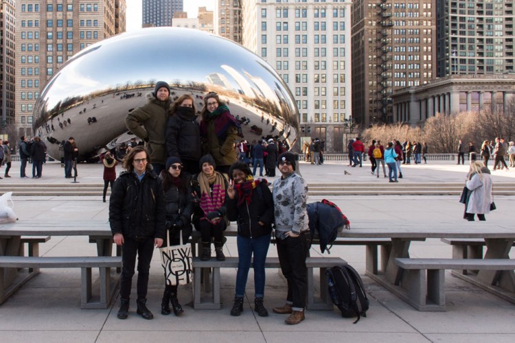 Students pose in front of the Bean in Chicago.