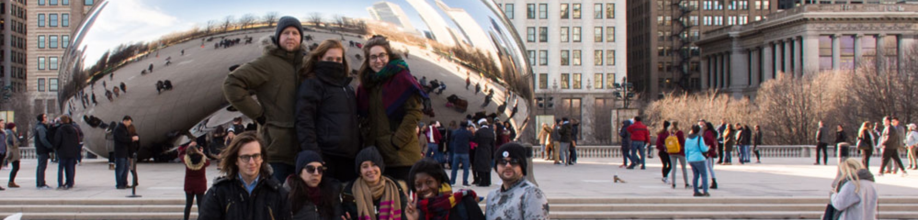 Students pose in front of the Bean in Chicago.
